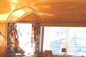 Photo of amazing ceiling wood paneling in 1948 Spartan Manor Trailer dining room